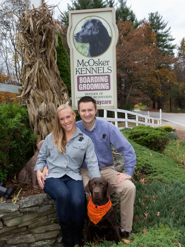 McOsker Kennel Sign with owners